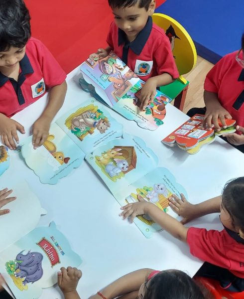Reading colourful story books , sparking their imagination and learning new words